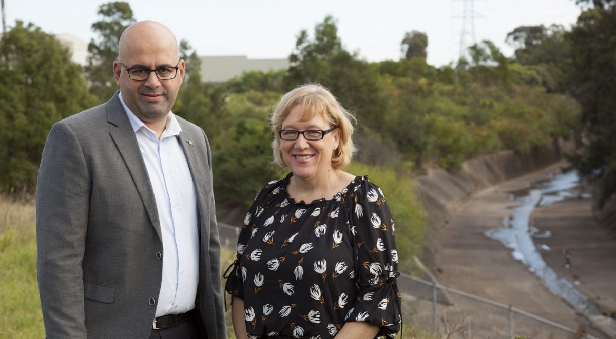 Cooks River Alliance Deputy Chair, Strathfield Councillor Maryanne Duggan, and Canterbury Bankstown Mayor Khal Asfour, stand at the junction of Coxs Creek and the Cooks River