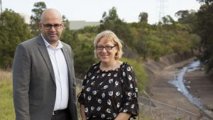 Cooks River Alliance Deputy Chair, Strathfield Councillor Maryanne Duggan, and Canterbury Bankstown Mayor Khal Asfour, stand at the junction of Coxs Creek and the Cooks River
