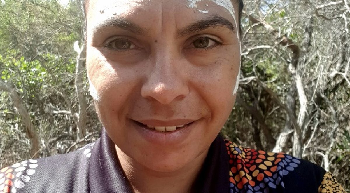 Aboriginal woman with ochre paint on face