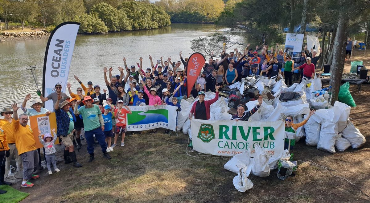 Large crowd that attended the Paddle Against Plastic event in 2019 showing some of the garbage collected